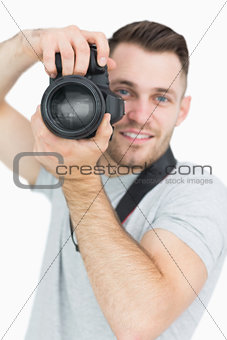 Portrait of male photographer with photographic camera