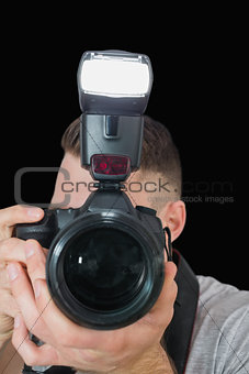 Closeup of photographer with photographic camera