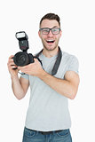 Portrait of cheerful photographer with photographic camera