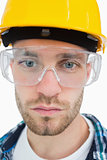 Closeup of architect wearing protective eyewear and hardhat