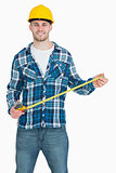 Portrait of smiling male architect with tape measure