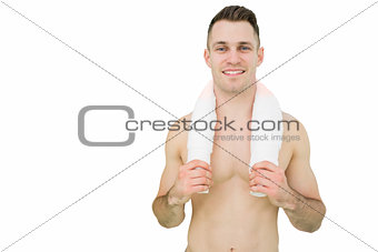 Portrait of happy man holding towel around neck
