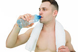 Shirtless man drinking water with towel around neck