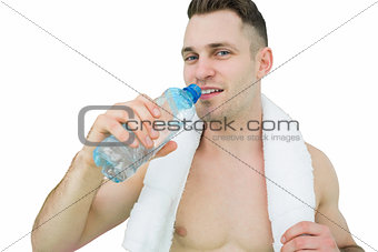 Portrait of man drinking water with towel around neck