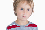 Closeup portrait of cute young boy with blue eyes