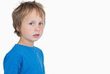 Portrait of cute young boy standing