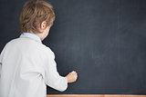 Boy dressed as teacher and writes on black board