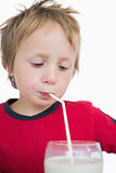 Cute little boy with glass of milk