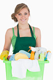 Portrait of young maid carrying cleaning supplies