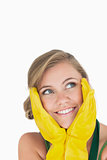 Closeup of smiling young maid with yellow gloves