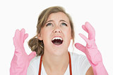 Closeup of young maid in pink gloves screaming