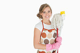 Portrait of smiling woman with cleaning supplies
