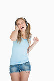 Young woman enjoying music over headphones