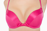 Extreme closeup of woman in pink bra