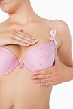 Closeup of woman performing self breast examination