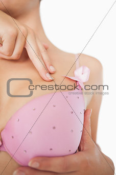 Extreme closeup of woman performing self breast examination