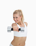 Portrait of woman exercising with dumbbell