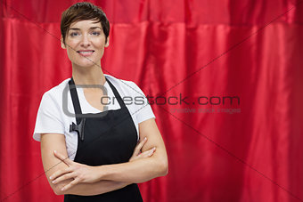 Portrait of a hairdresser with arms crossed