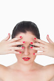 Woman with red lips and red painted finger nails over face