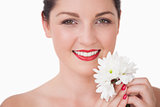 Closeup of young woman holding flower