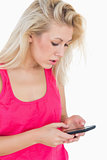 Casual young woman using smartphone
