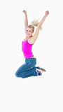 Portrait of an excited casual woman jumping in air