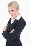 Portrait of confident young business woman standing with arms crossed