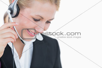 Closeup of young business woman wearing headset