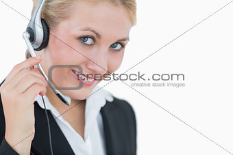 Closeup portrait of young business woman wearing headset