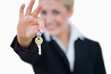 Business woman holding out key