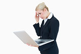 Worried businesswoman on laptop