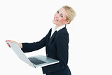 Happy young businesswoman using laptop