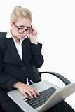 Portrait of worried businesswoman using laptop