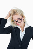 Portrait of frustrated business woman scratching head