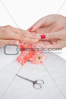 Closeup of woman getting manicure done