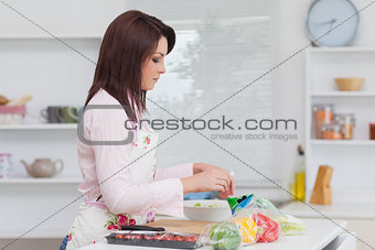 Yoman preparing food in the kitchen
