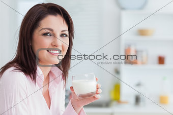 Young woman with glass of milk