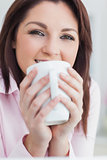 Closeup of woman with coffee cup