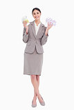 Happy business woman holding fanned banknotes