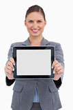 Smiling business woman holding digital tablet