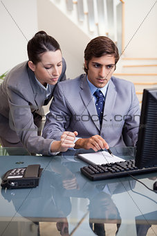 Business colleagues at office desk