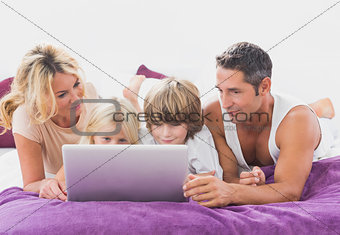 Family using together a laptop