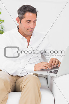 Focused man using his laptop