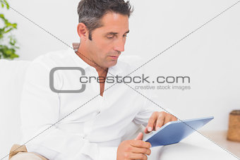 Man using his digital tablet
