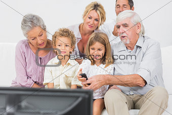 Family watching tv together