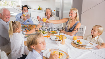 Happy family raising their glasses