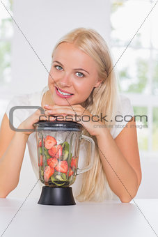 Woman putting hands on the mixer