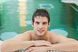 Smiling man in a swimming pool