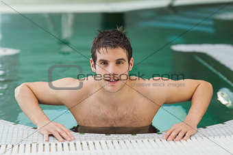 Man getting out of swimming pool