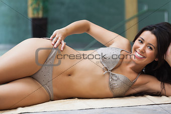 Girl relaxing by the pool